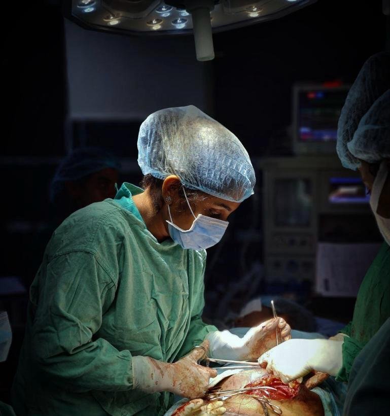 Dr. Meghana Reddy performing surgical care in the operating room